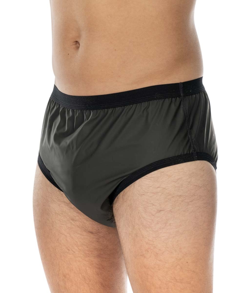Anatomisch geformte, dunkelgrüne Unterwäsche mit elastischem schwarzen Bund, körpernah getragen. Der Hintergrund ist hell und neutral, wodurch das Produkt hervorsticht.